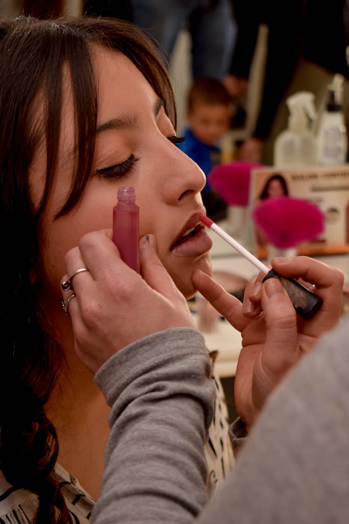 A Woman Putting Lip Tint