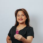 Beautician Posing with a Set of Liner Brushes